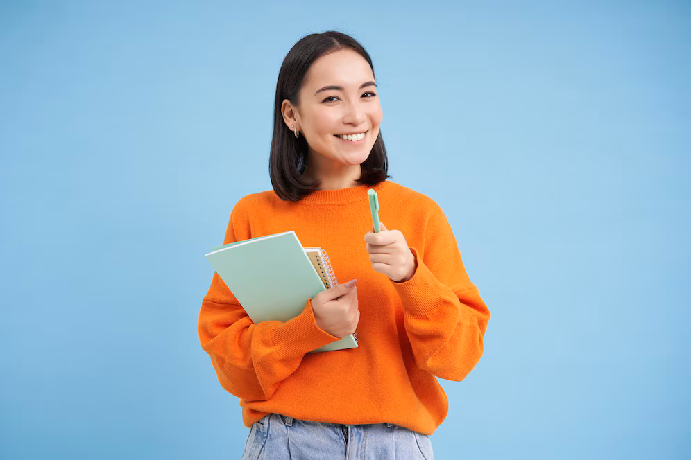 education-students-happy-asian-woman-holding-notebooks-laughing-smiling-camera-enjoys-goi_1258-167794